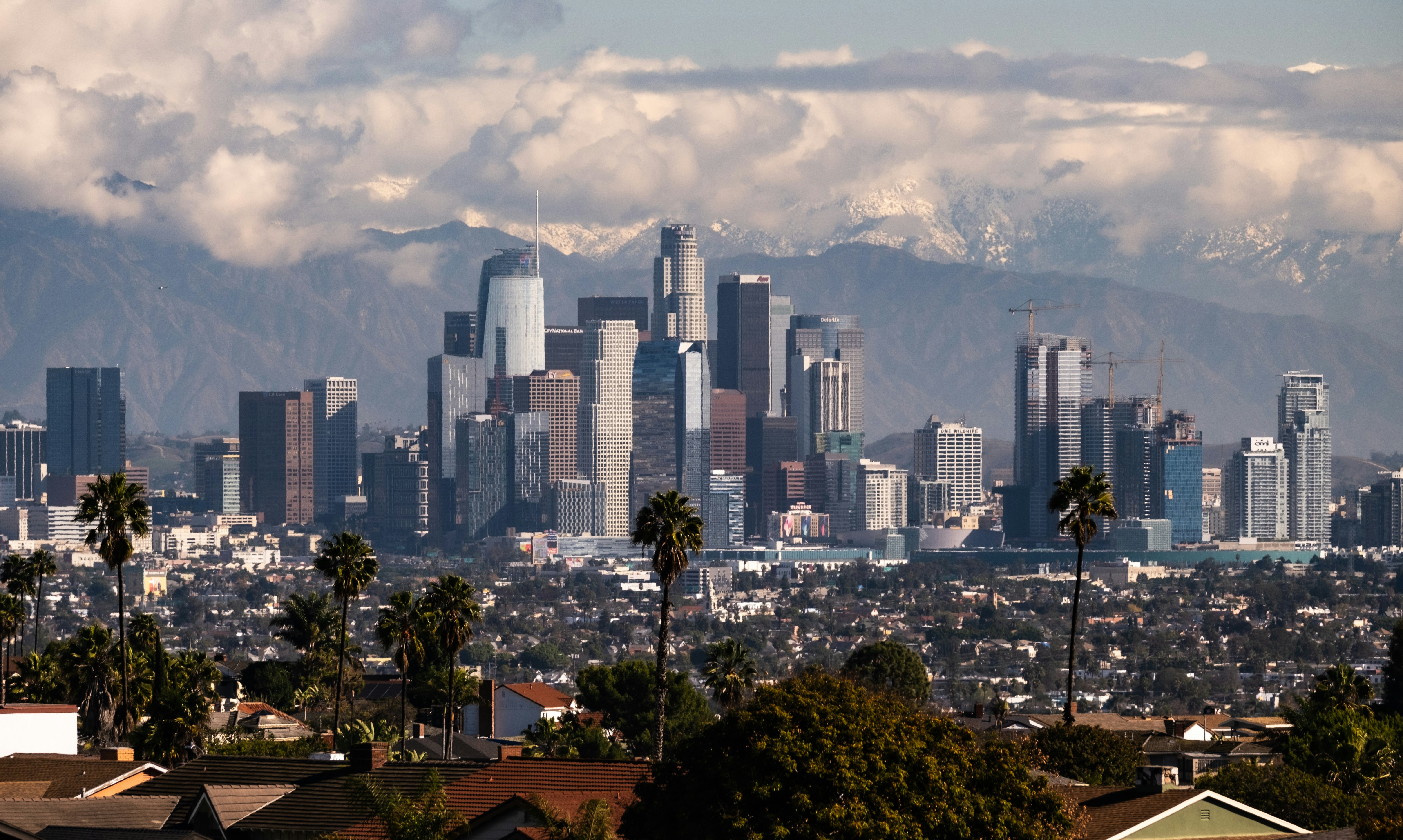 a view of a city with mountains in the background